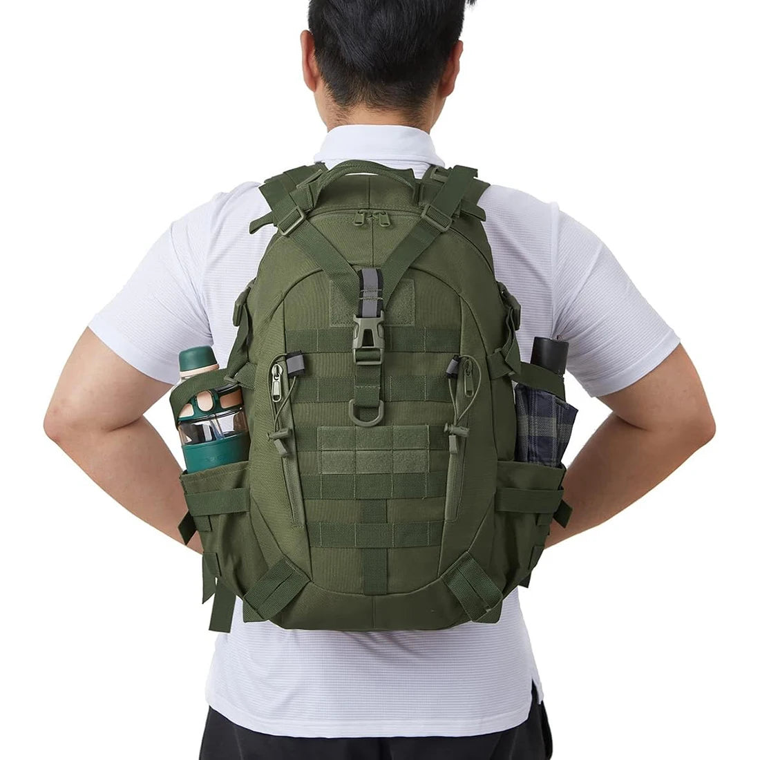 Person wearing a green tactical backpack with a white shirt